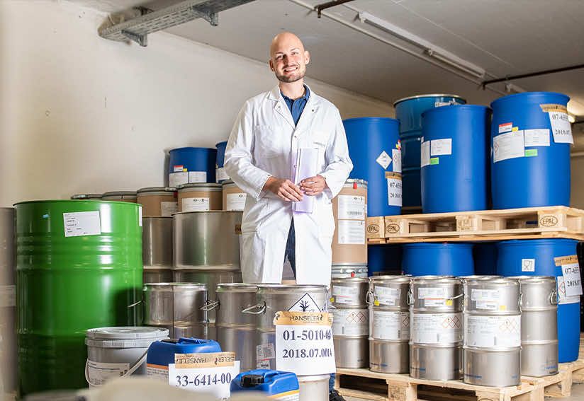 Hänseler AG employee in high-bay warehouse